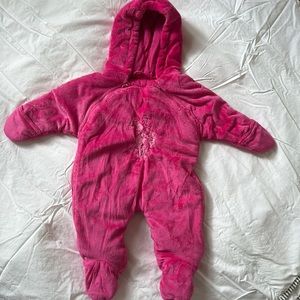 Bright pink snow suit